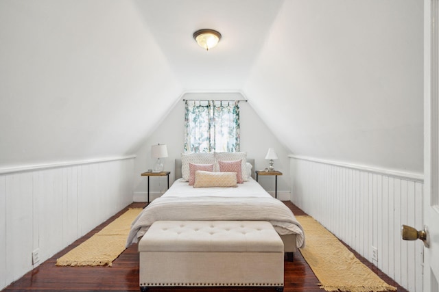 bedroom featuring dark hardwood / wood-style flooring and vaulted ceiling