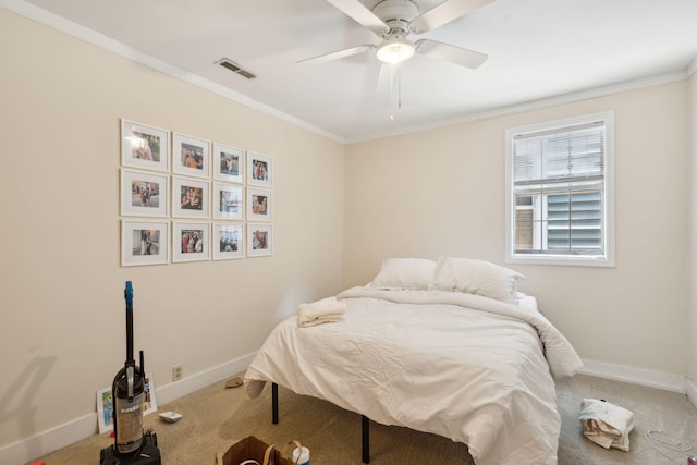 bedroom with carpet floors, ceiling fan, and ornamental molding