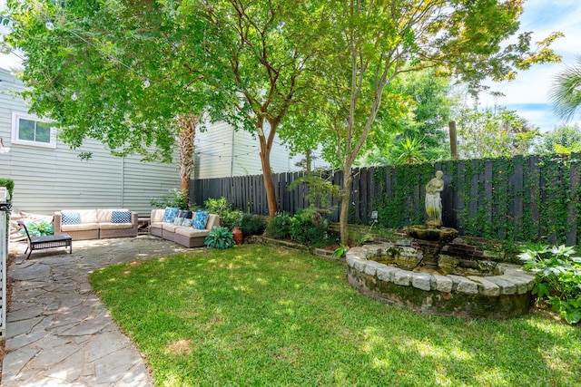 view of yard featuring an outdoor living space and a patio