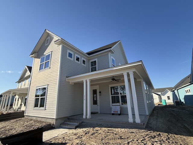 view of front of home with a porch and ceiling fan