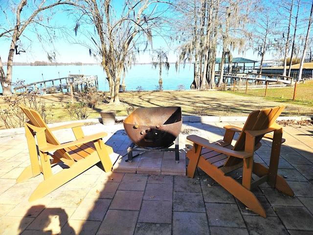 view of patio with a water view