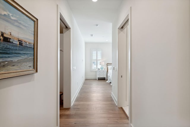 corridor featuring light wood-type flooring