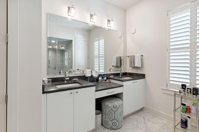 bathroom with vanity, walk in shower, and tile patterned floors