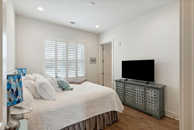 bedroom with hardwood / wood-style floors