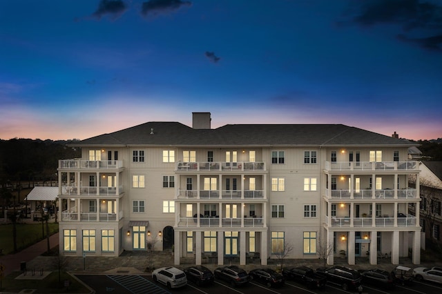 view of outdoor building at dusk