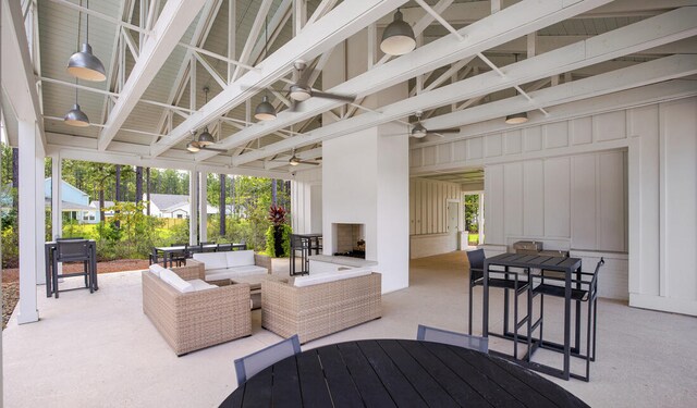 view of patio featuring an outdoor living space and ceiling fan