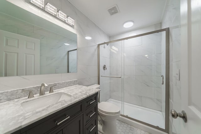 bathroom with visible vents, a shower stall, and toilet