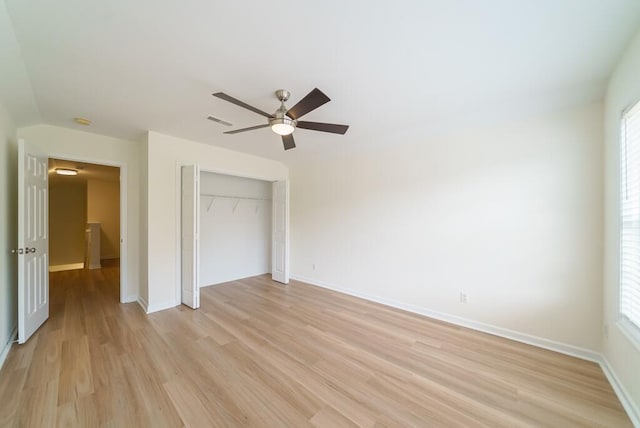 unfurnished bedroom with visible vents, a ceiling fan, baseboards, a closet, and light wood-type flooring