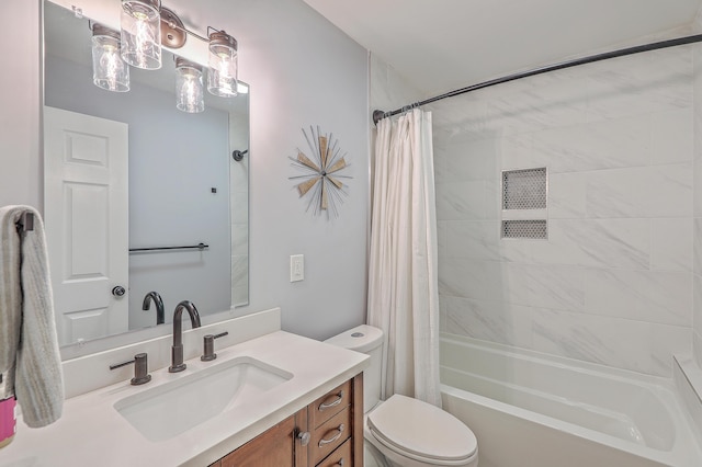 full bathroom with vanity, toilet, and shower / tub combo