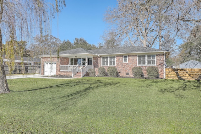 single story home featuring covered porch, a garage, and a front lawn