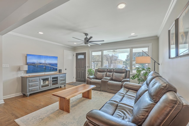 living room featuring ceiling fan, light hardwood / wood-style flooring, and ornamental molding