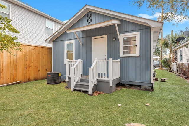 exterior space featuring a yard and cooling unit