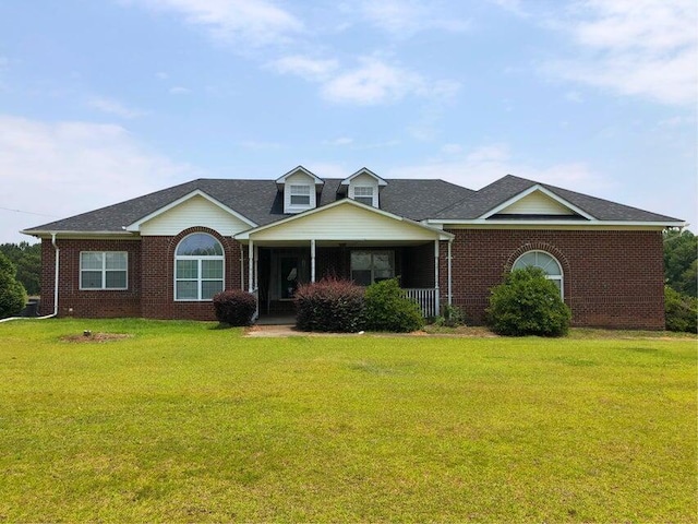 view of front of house featuring a front yard and covered porch