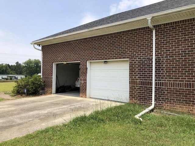 view of side of home with a garage and an outdoor structure