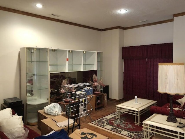 misc room featuring dark hardwood / wood-style flooring and ornamental molding