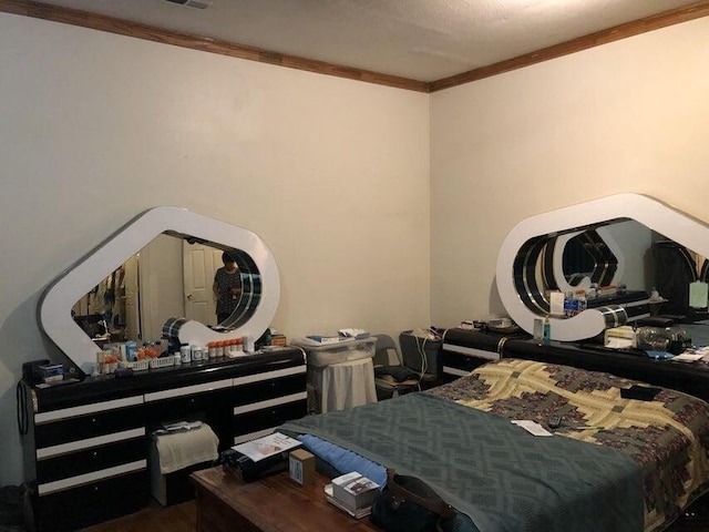 bedroom with ornamental molding