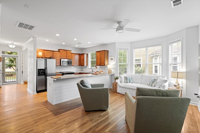 3000 Treadwell St, Mount Pleasant, SC 29466 - living area featuring light wood finished floors, recessed lighting, a ceiling fan, and baseboards
