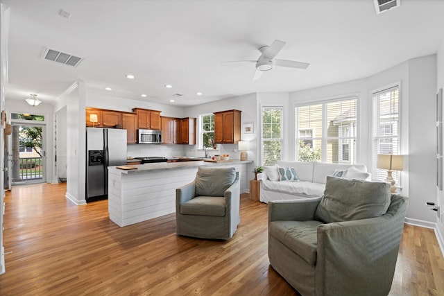 3000 Treadwell St, Mount Pleasant, SC 29466 - living area featuring recessed lighting, light wood-style floors, ceiling fan, and baseboards