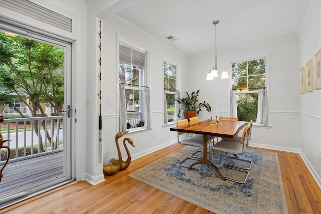 3000 Treadwell St, Mount Pleasant, SC 29466 - dining space with ornamental molding, plenty of natural light, wood finished floors, a chandelier, and baseboards