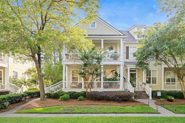3000 Treadwell St, Mount Pleasant, SC 29466 - greek revival house featuring a balcony, a porch, a shingled roof, and stairway