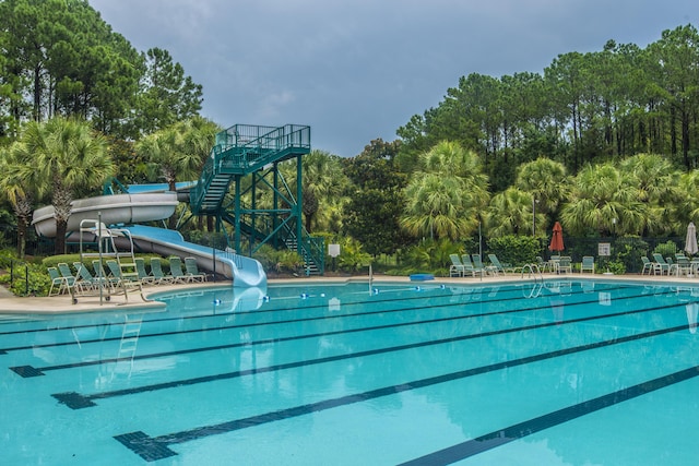 3000 Treadwell St, Mount Pleasant, SC 29466 - community pool featuring a water slide, view of scattered trees, and a patio