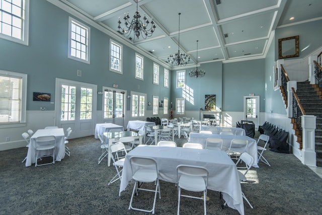 3000 Treadwell St, Mount Pleasant, SC 29466 - carpeted dining space with a chandelier, coffered ceiling, a high ceiling, stairs, and a wainscoted wall