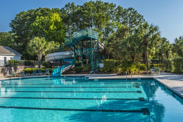 3000 Treadwell St, Mount Pleasant, SC 29466 - community pool featuring a water slide, view of wooded area, and a patio