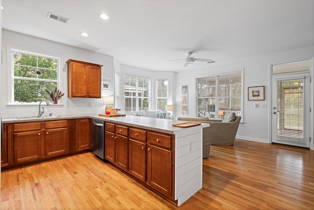 3000 Treadwell St, Mount Pleasant, SC 29466 - kitchen with a sink, dishwasher, light wood-type flooring, a peninsula, and recessed lighting