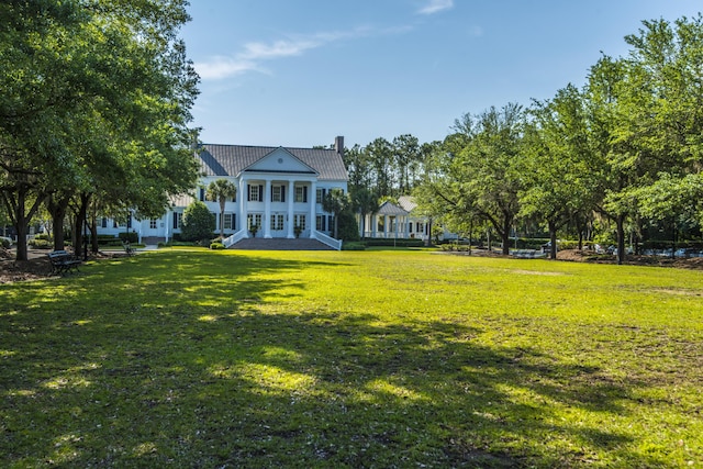 3000 Treadwell St, Mount Pleasant, SC 29466 - back of property featuring a chimney, a yard, metal roof, and a porch