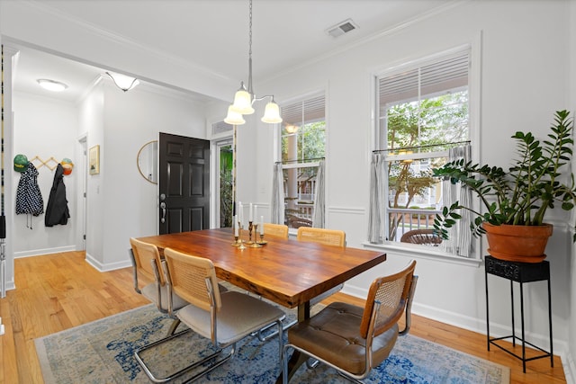 3000 Treadwell St, Mount Pleasant, SC 29466 - dining area with light wood-style flooring, ornamental molding, baseboards, and a chandelier