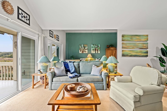 living room featuring carpet floors and vaulted ceiling