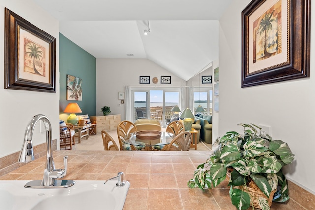 dining room with vaulted ceiling