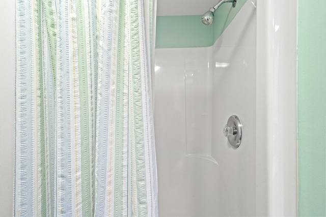 interior space featuring a shower with curtain