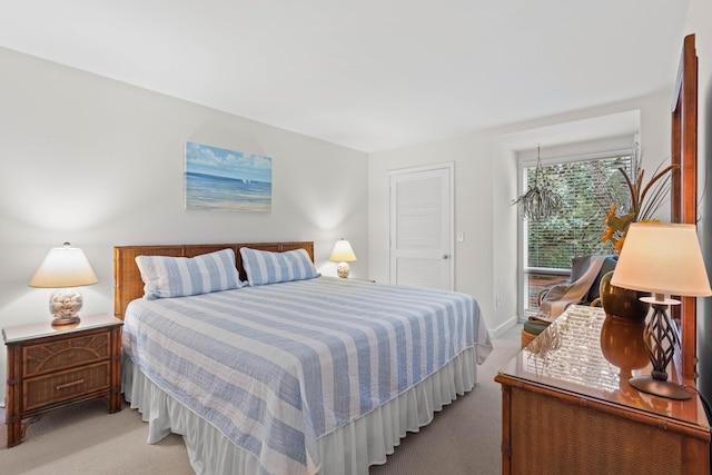 carpeted bedroom with baseboards