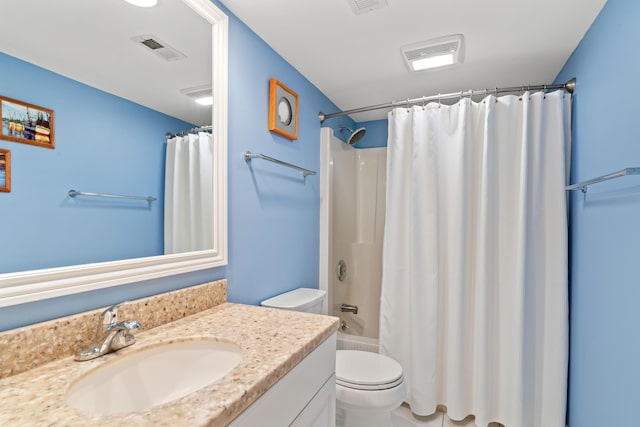 full bathroom featuring vanity, toilet, visible vents, and shower / tub combo with curtain