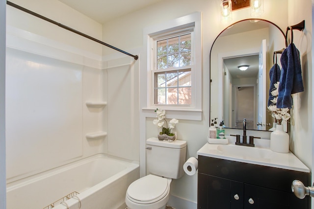 bathroom featuring bathing tub / shower combination, vanity, and toilet