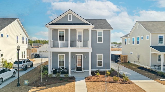 view of front of property featuring a porch and a balcony