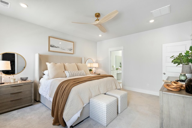 carpeted bedroom featuring connected bathroom and ceiling fan