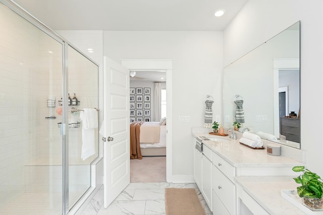 bathroom featuring walk in shower and vanity