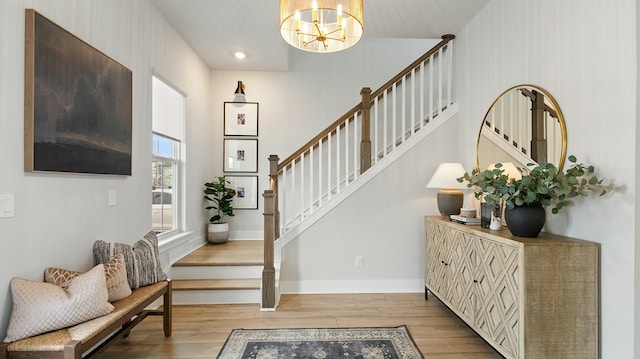 entrance foyer featuring a notable chandelier and light hardwood / wood-style floors