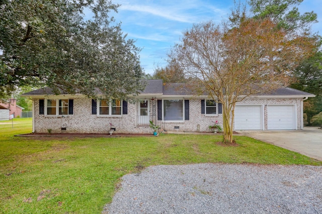 ranch-style house with a garage and a front yard