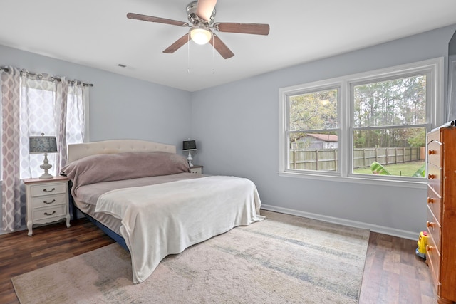 bedroom featuring dark hardwood / wood-style floors and ceiling fan