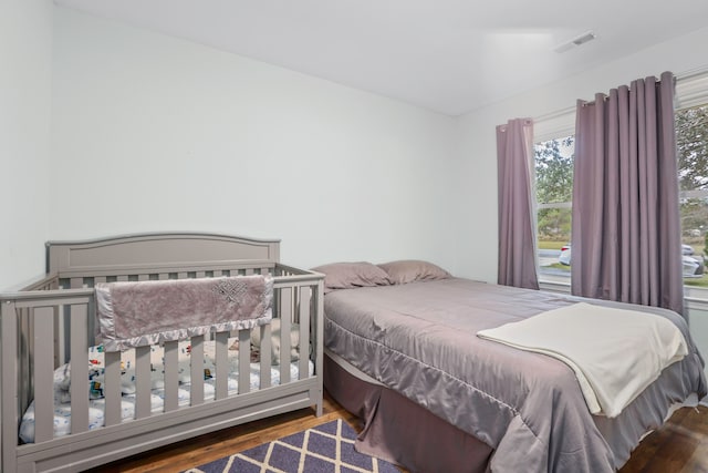 bedroom featuring wood-type flooring