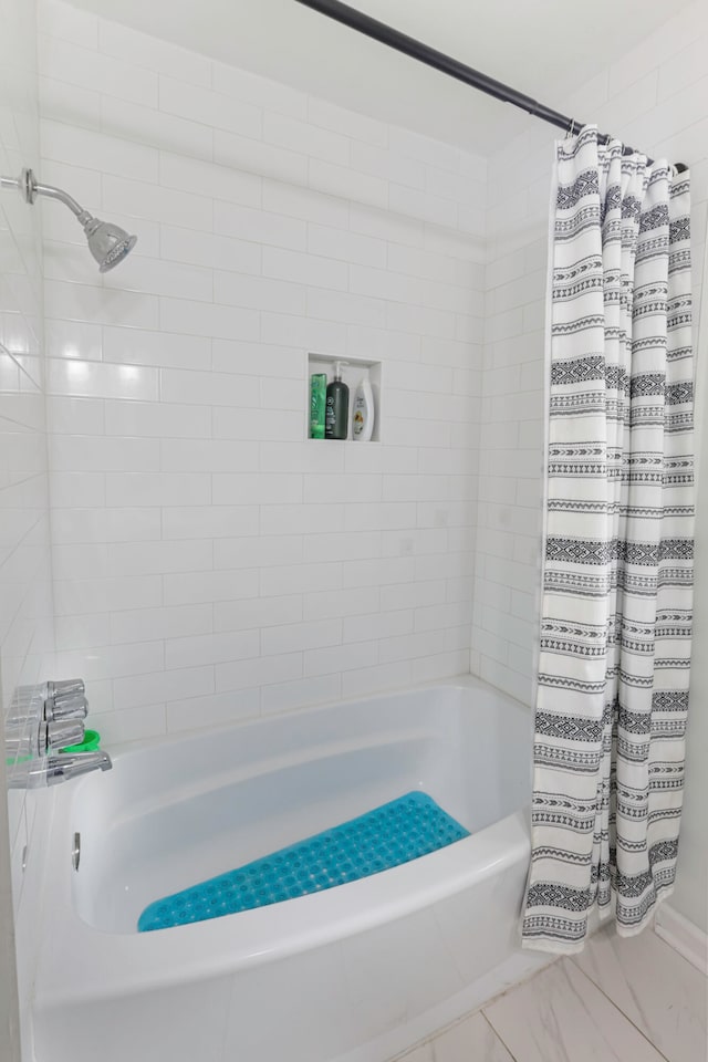 bathroom with shower / bath combo