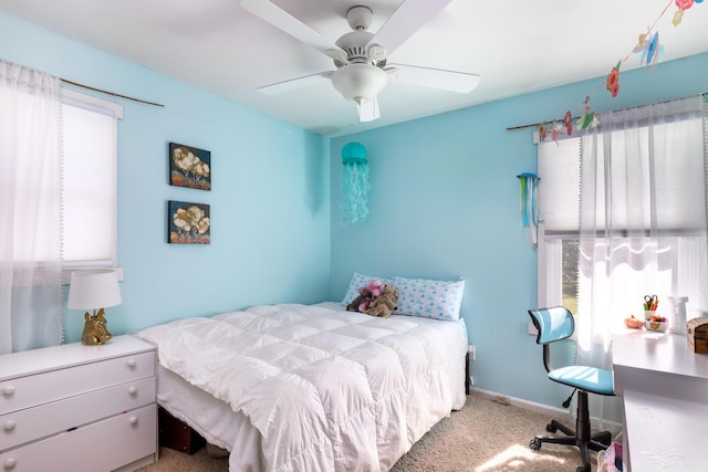 bedroom with light carpet and ceiling fan