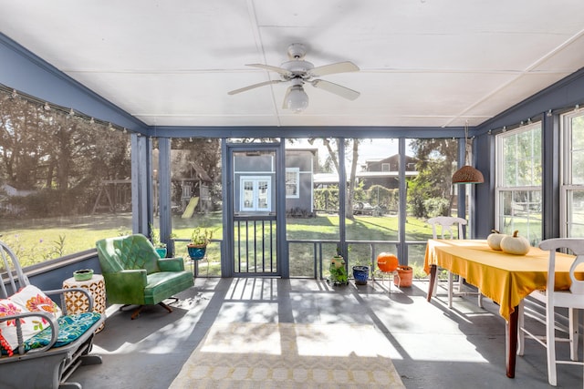 sunroom featuring ceiling fan and a wealth of natural light