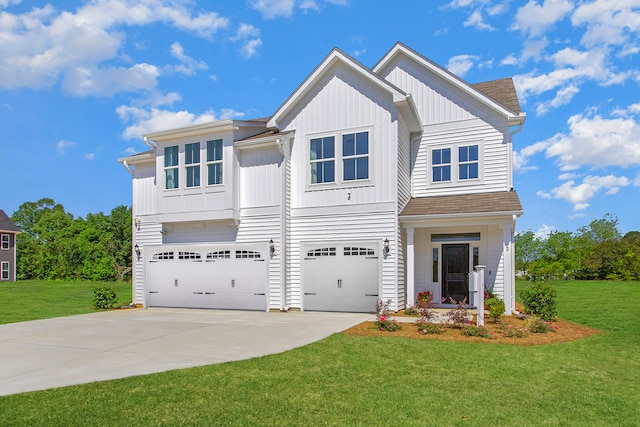 view of front of home featuring a front yard and a garage