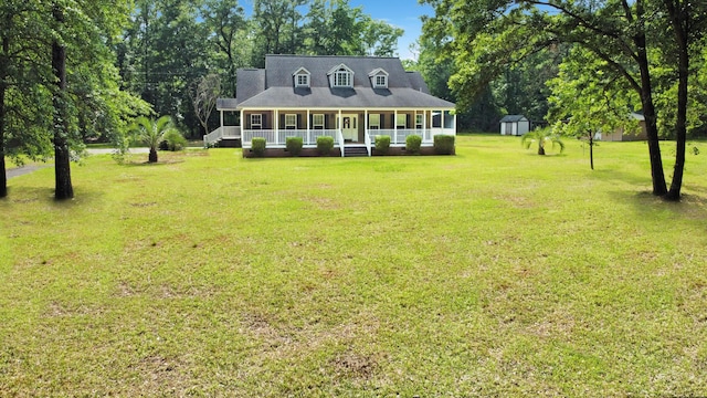 1514 Reevesville Rd, Bowman, SC 29018 - rear view of house featuring a porch, a storage unit, a lawn, and an outdoor structure