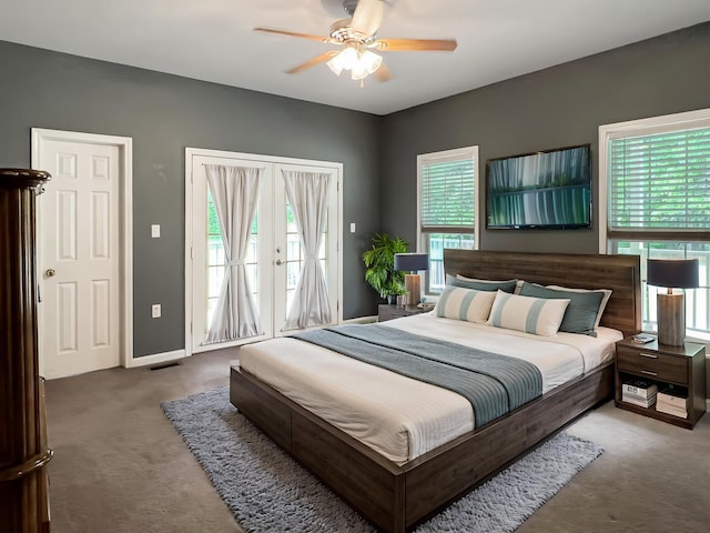 1514 Reevesville Rd, Bowman, SC 29018 - bedroom featuring carpet flooring, access to exterior, and multiple windows