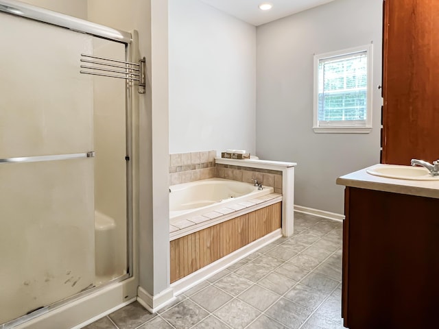 1514 Reevesville Rd, Bowman, SC 29018 - bathroom with a shower stall, a bath, baseboards, vanity, and recessed lighting